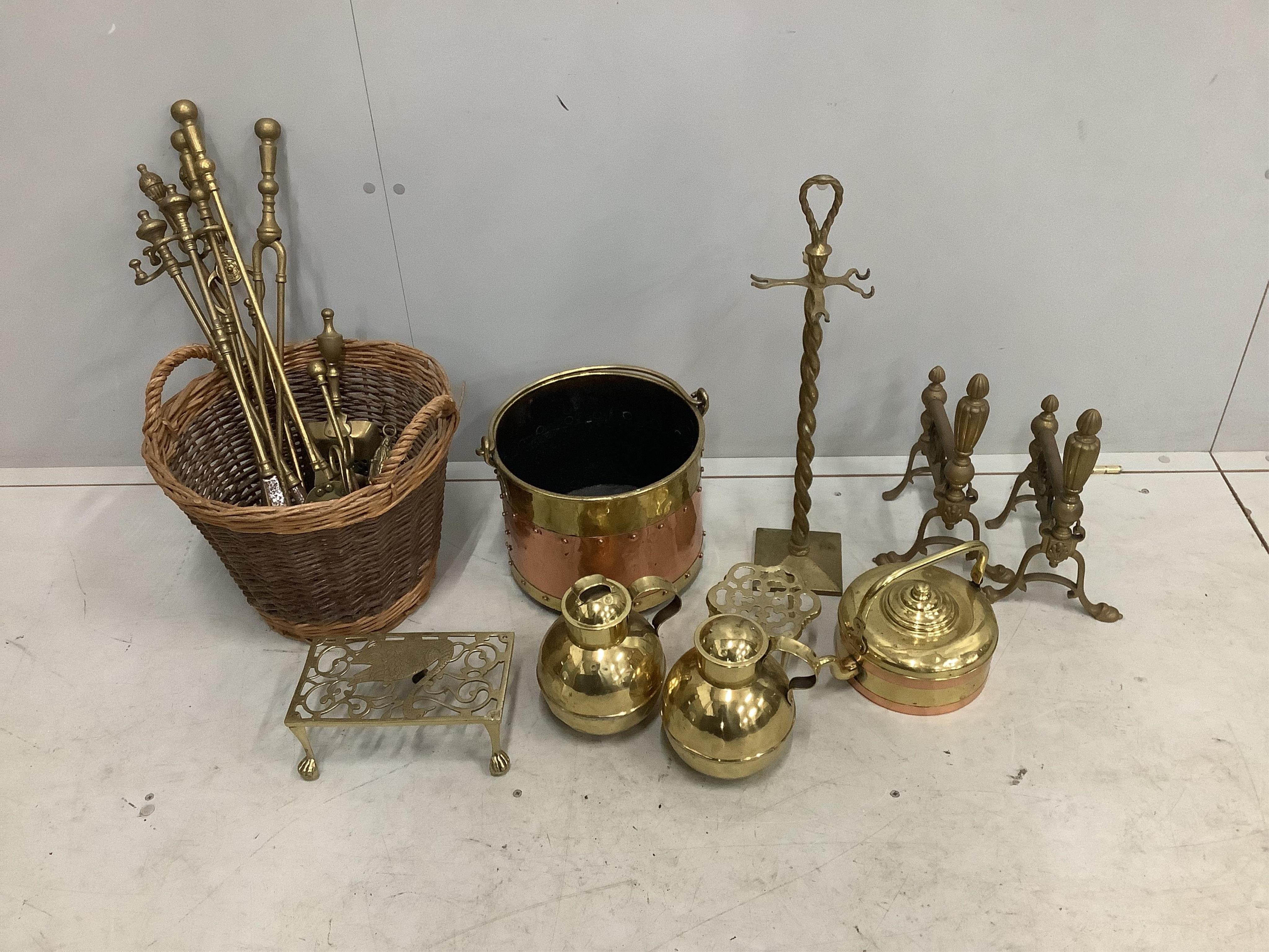 A quantity of assorted Victorian and later brass and copper ware to include fire implements, coal scuttle and two Jersey cream pans. Condition - fair to good